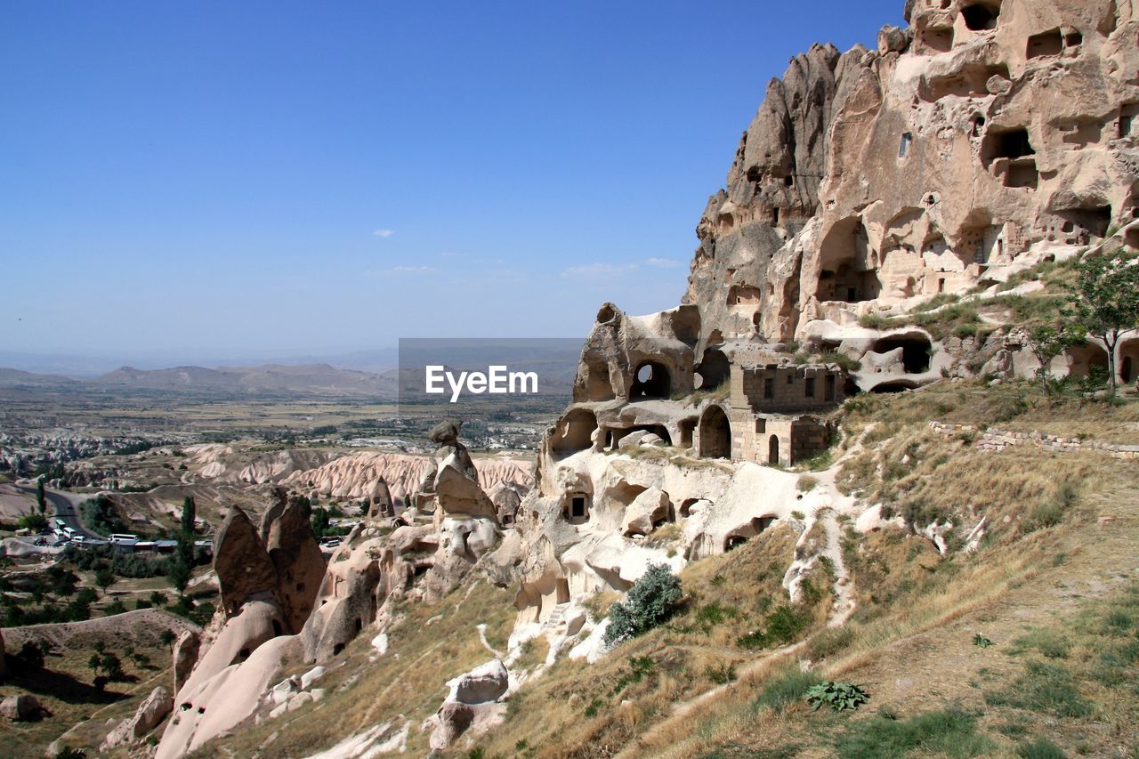 View of uchisar castle against blue sky
