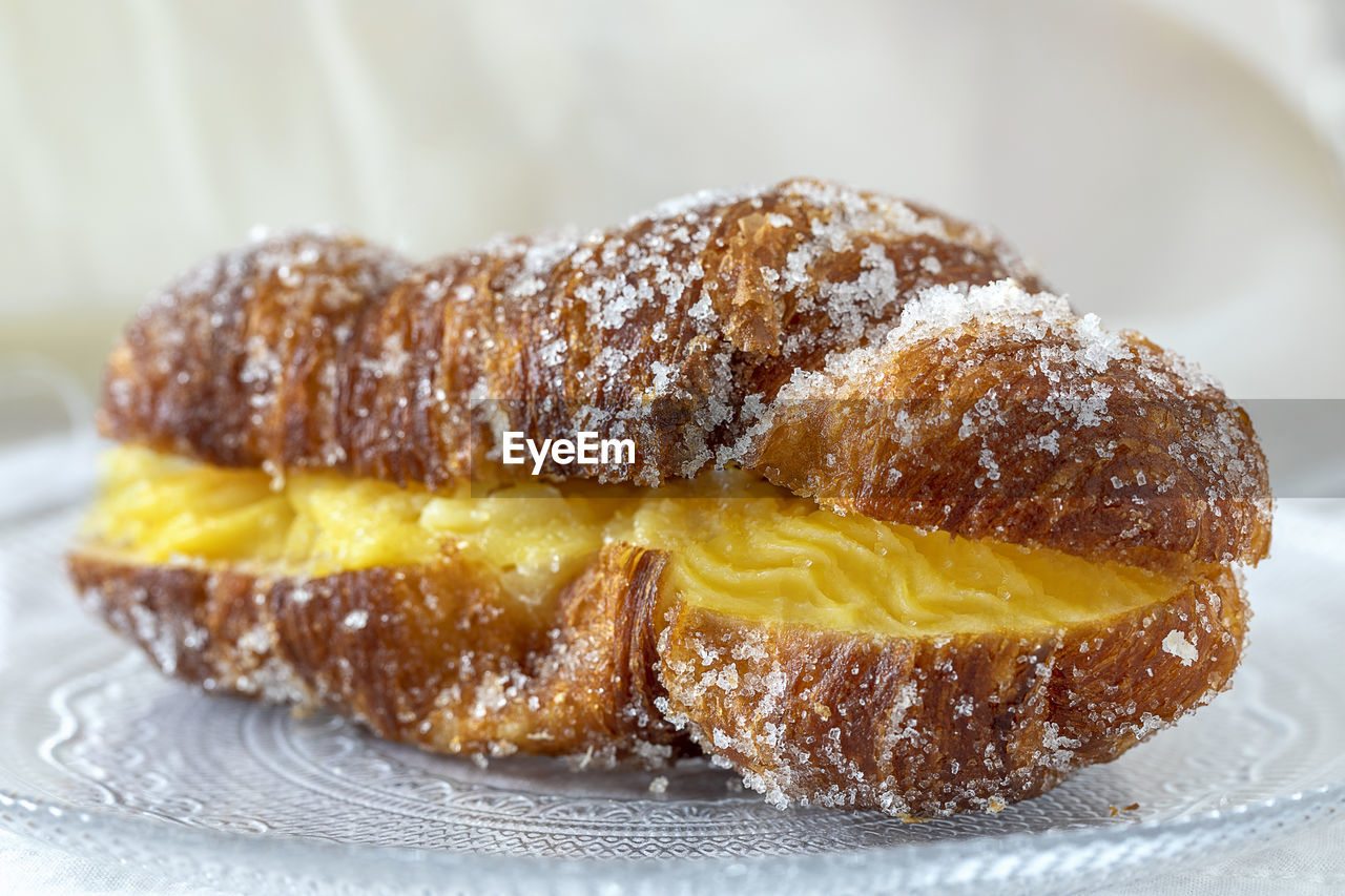A delicious pastry filled with yellow custard.