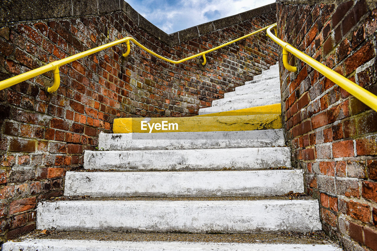 staircase, steps and staircases, stairs, architecture, wall, built structure, railing, no people, building exterior, wall - building feature, low angle view, day, nature, sky, the way forward, outdoors, brick, cloud, building, ancient history