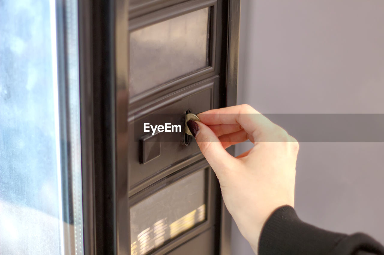 hand, one person, adult, door, indoors, entrance, window, business, close-up, cash, opening, room, interior design, handle, open, lifestyles