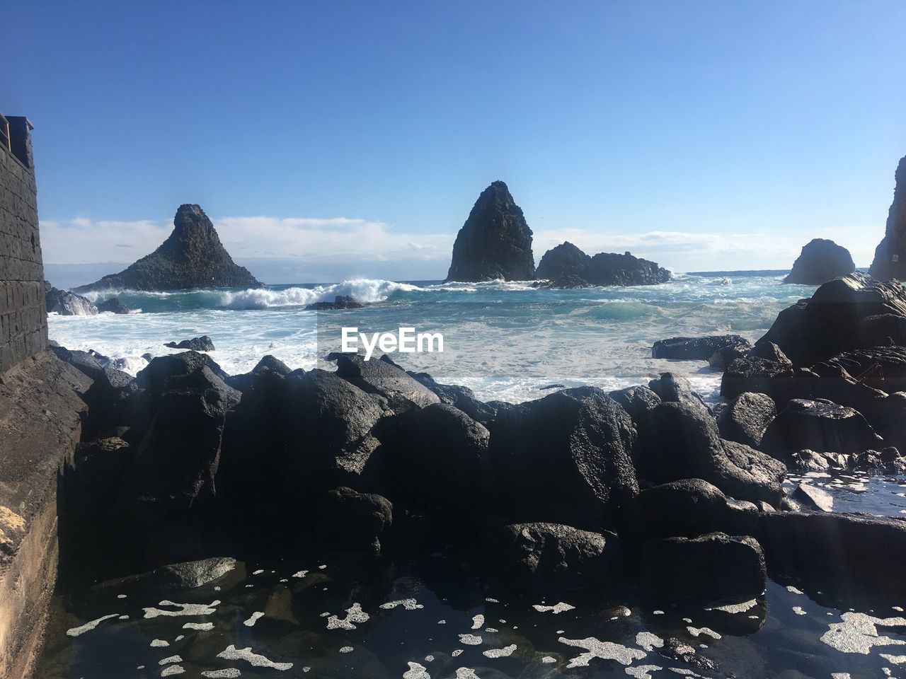 PANORAMIC VIEW OF BEACH AGAINST SKY