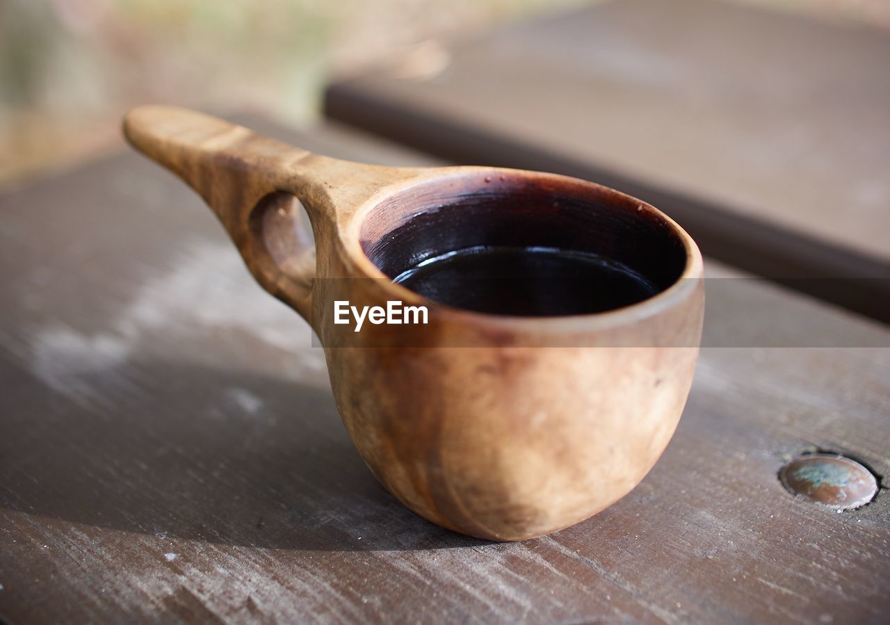 Close-up of coffee cup on table