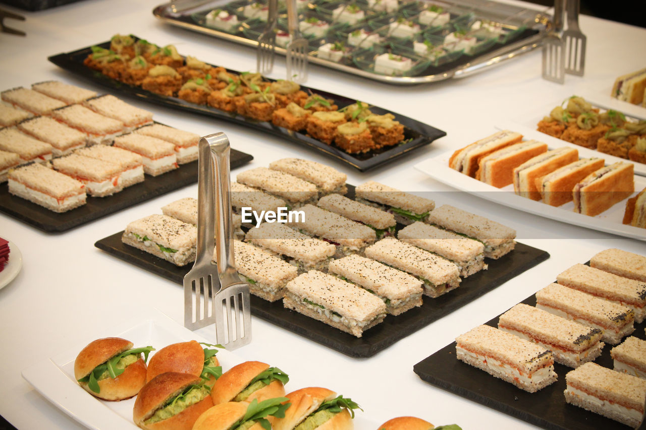 High angle view of food arranged in plates on table