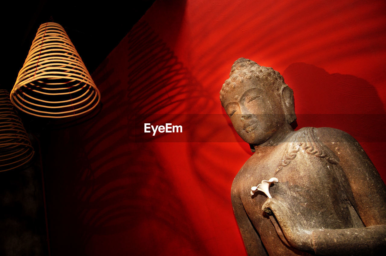 Low angle view of buddha statue in temple