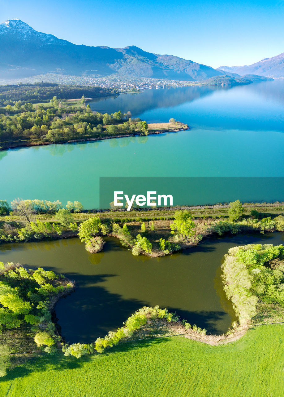 SCENIC VIEW OF LAKE AND MOUNTAIN AGAINST SKY