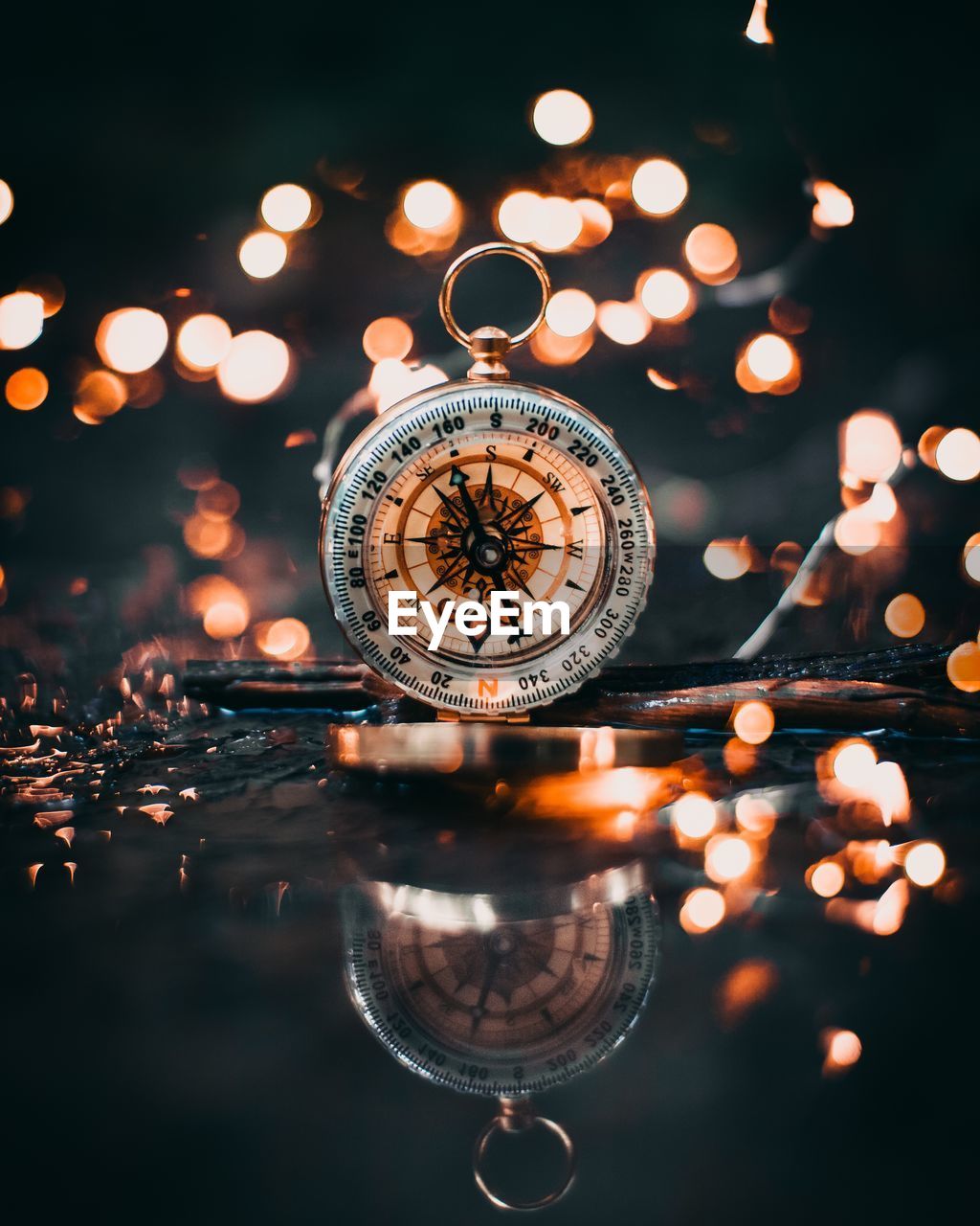 CLOSE-UP OF ILLUMINATED REFLECTION IN WATER