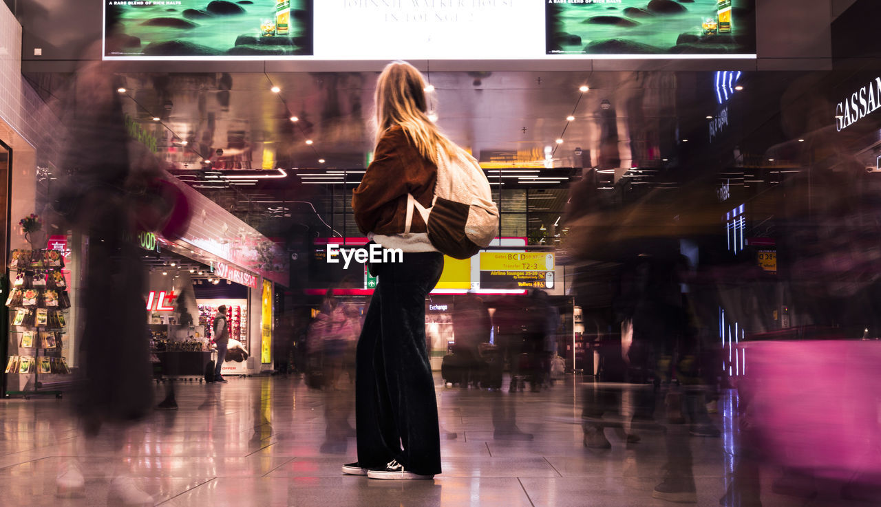 WOMAN AT SHOPPING MALL