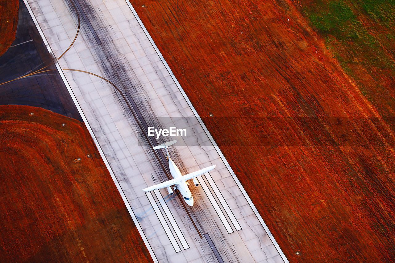 Aerial view of airplane on runway