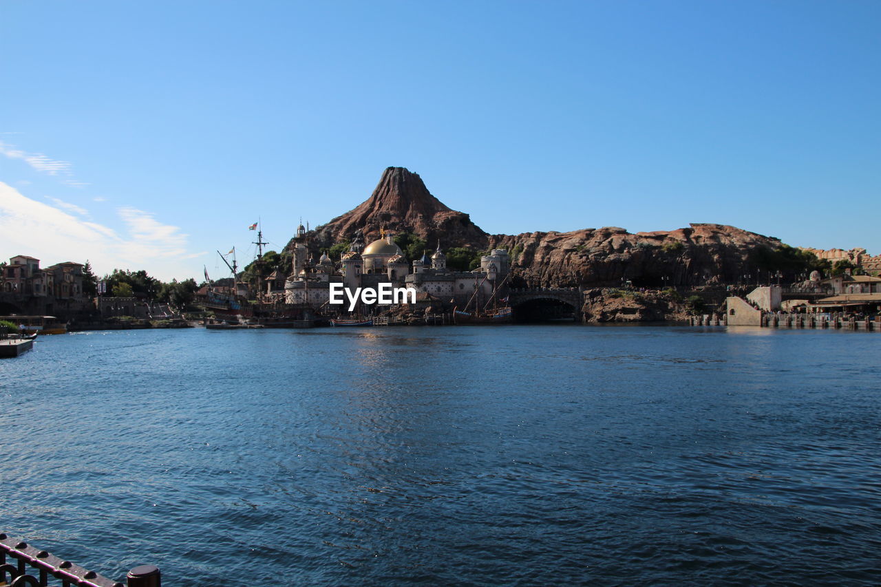 Scenic view of sea and buildings against sky