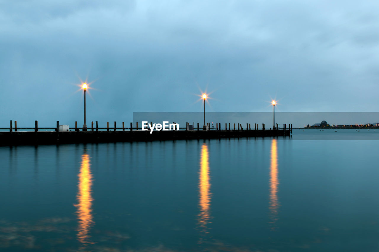 Scenic view of beach against sky at night