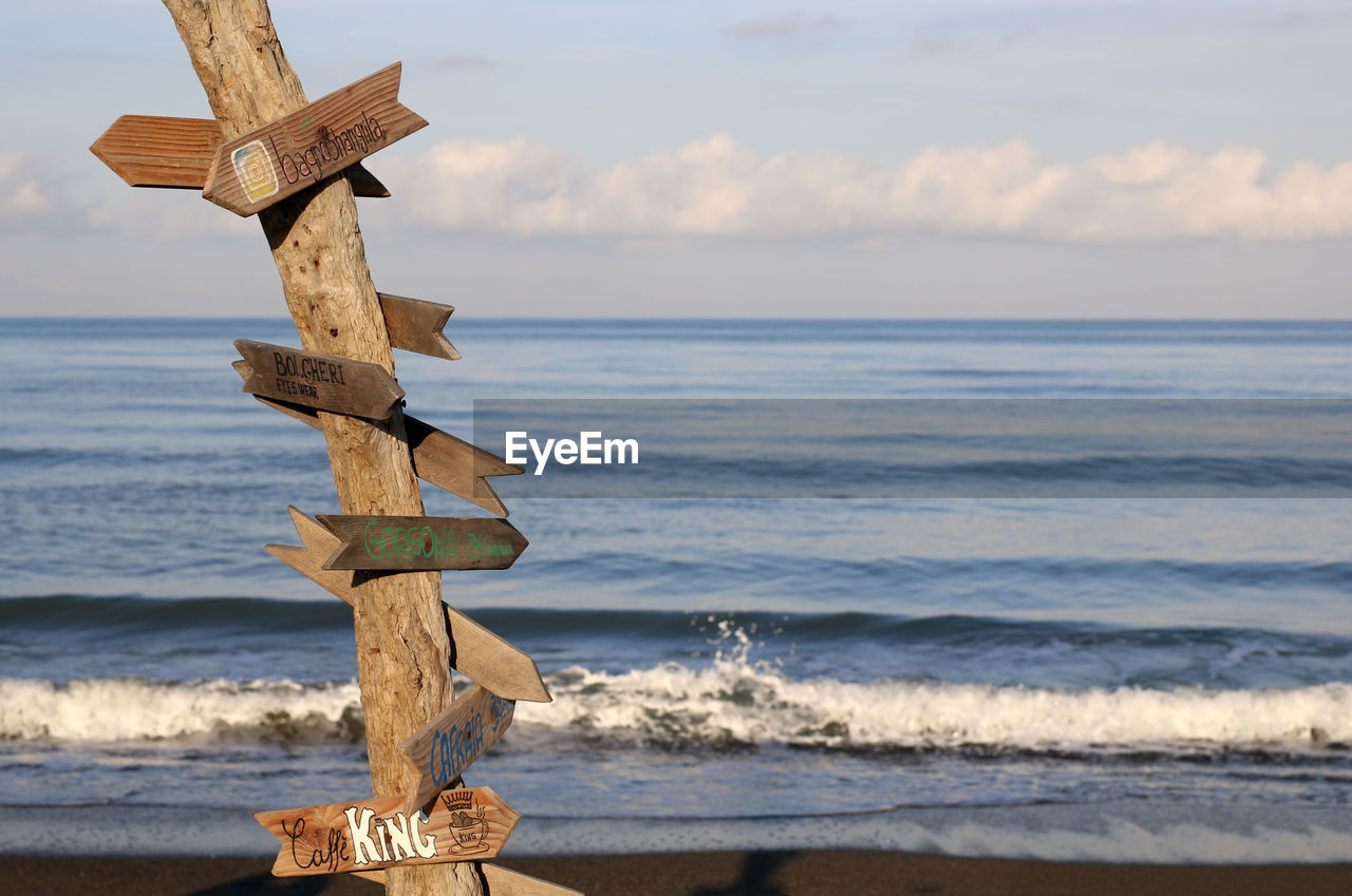 Italy, region tuscany. wooden signposts on the beach.