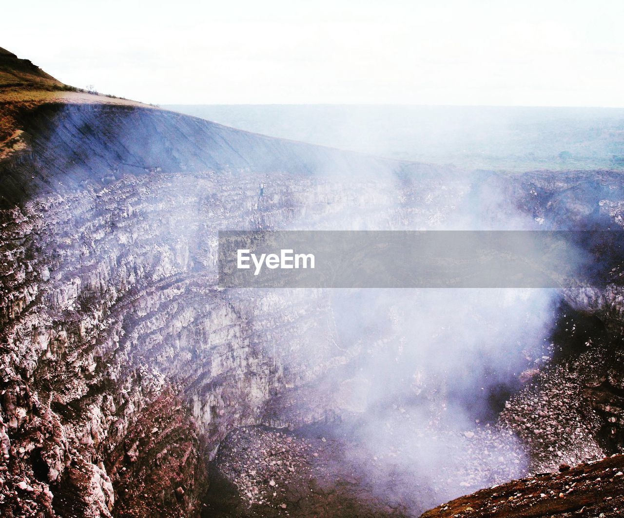 High angle view of smoke coming out from volcano