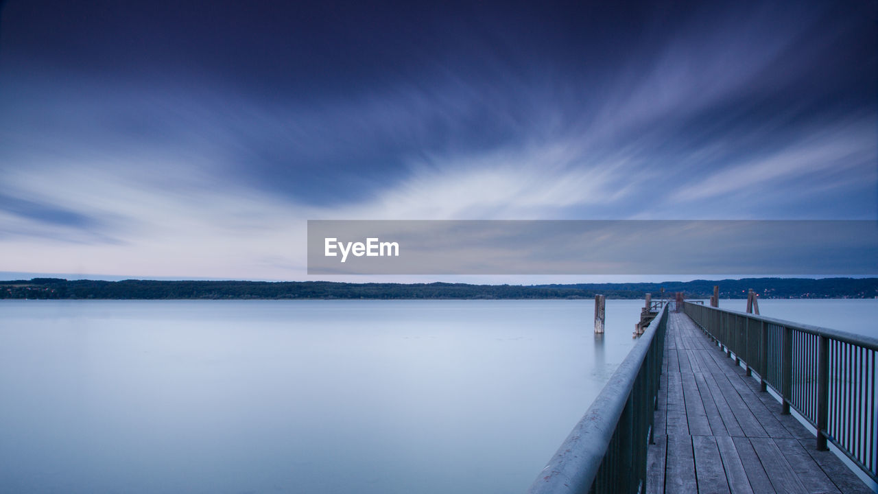 PIER AT LAKE AGAINST SKY