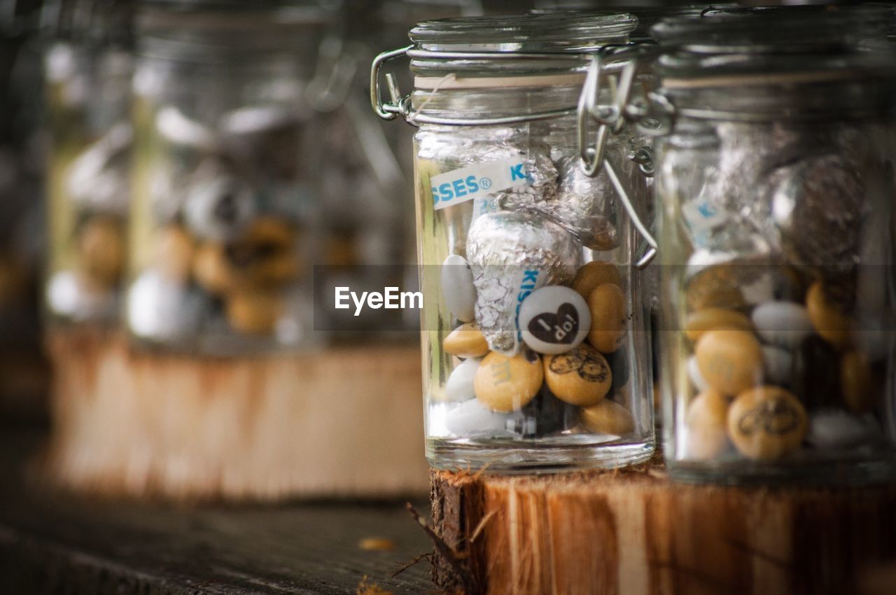 CLOSE-UP OF JAR ON TABLE