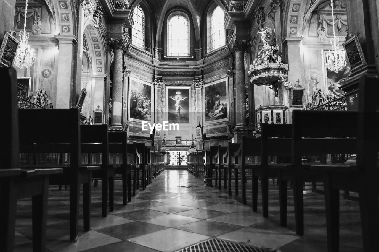 architecture, black and white, place of worship, built structure, religion, spirituality, belief, catholicism, monochrome, monochrome photography, building, indoors, pew, worship, no people, aisle, arch, travel destinations, seat, black, altar, the past, architectural column, day