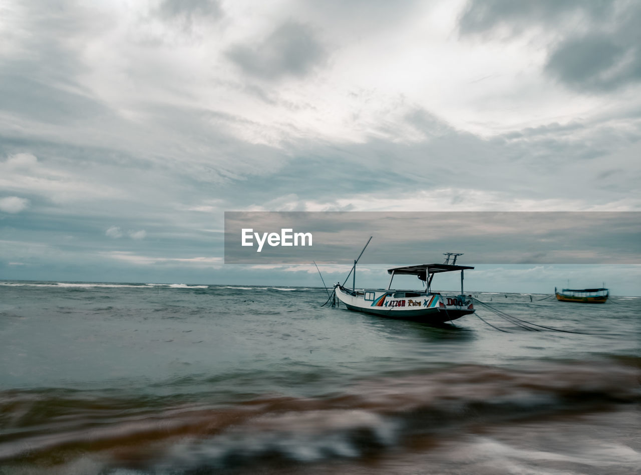 View of sailboat in sea against sky