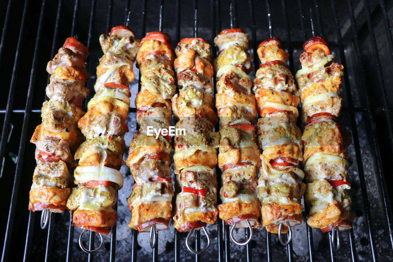 High angle view of meat on barbecue grill