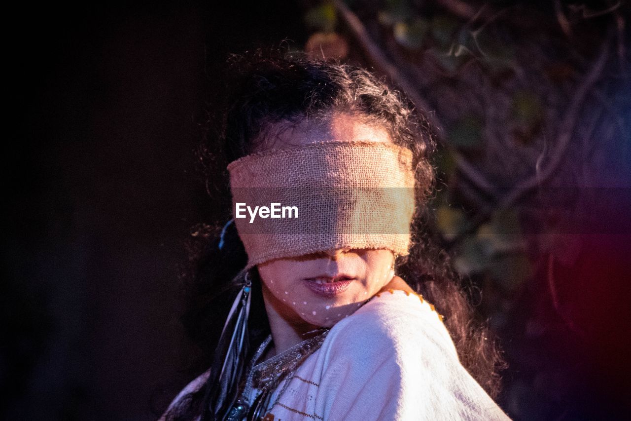 Close-up of woman wearing burlap