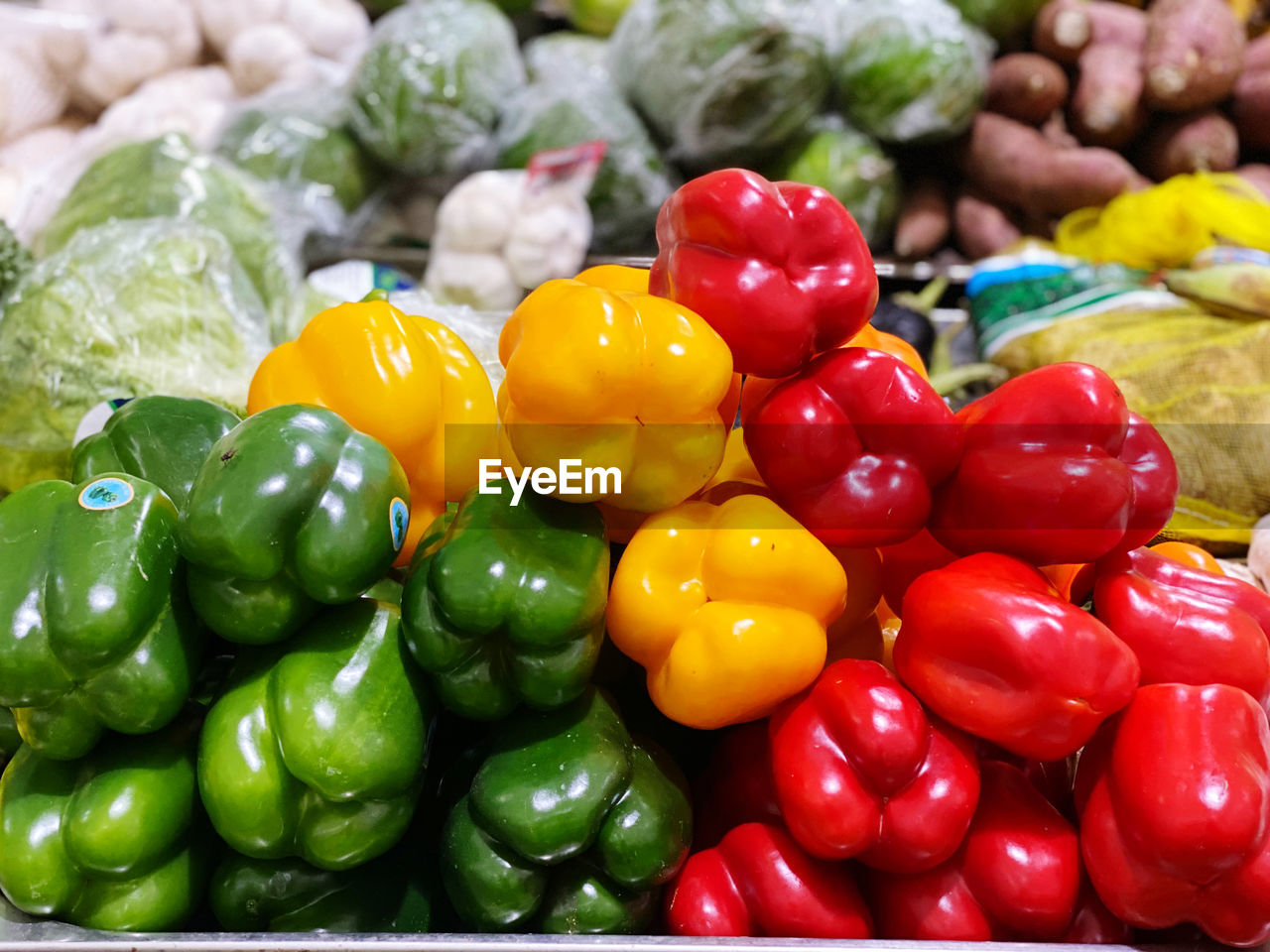 CLOSE-UP OF RED BELL PEPPERS FOR SALE