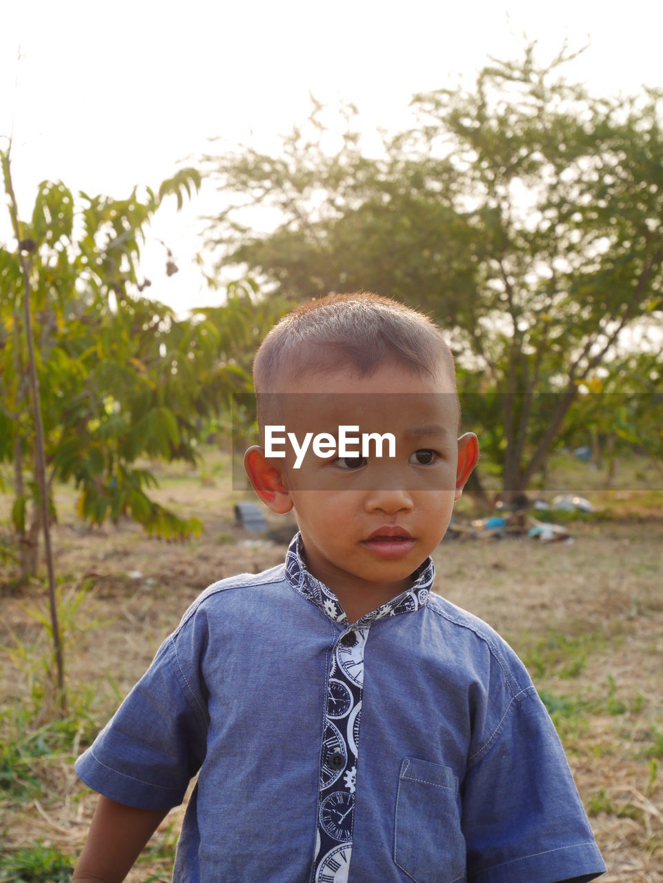 Close-up of cute boy on field