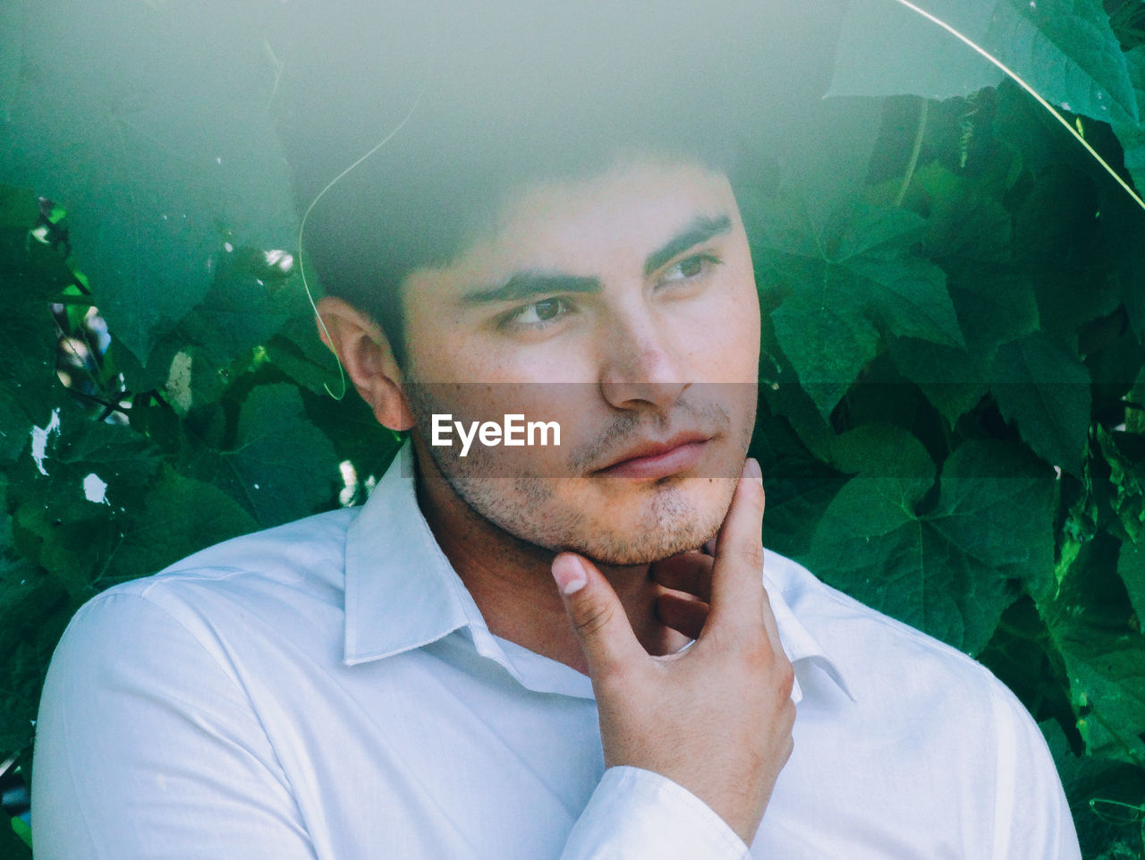 Close-up of man against plants at park