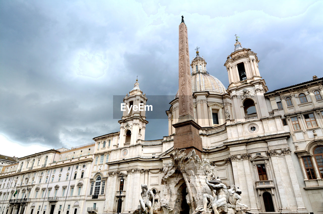 Low angle view of statue of building against sky