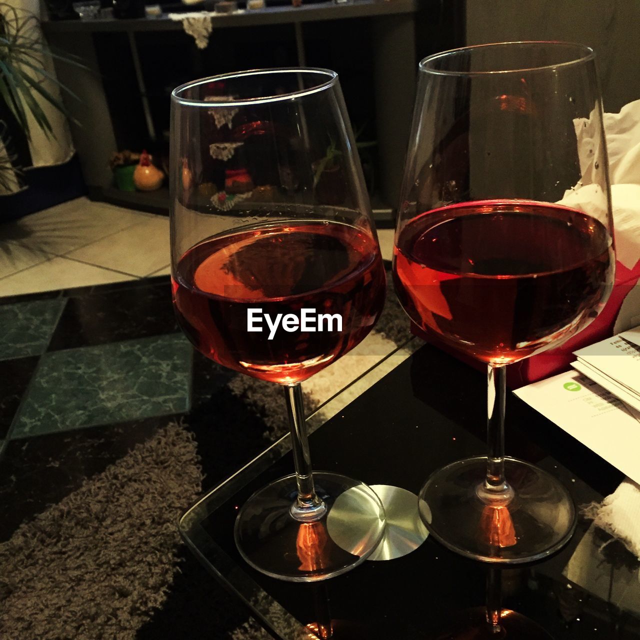 CLOSE-UP OF WINE GLASSES ON TABLE