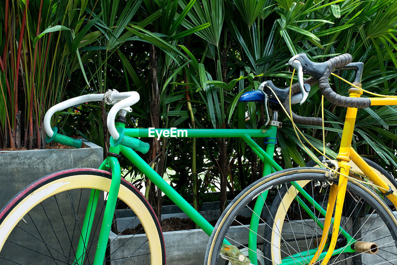 CLOSE-UP OF BICYCLE IN FIELD