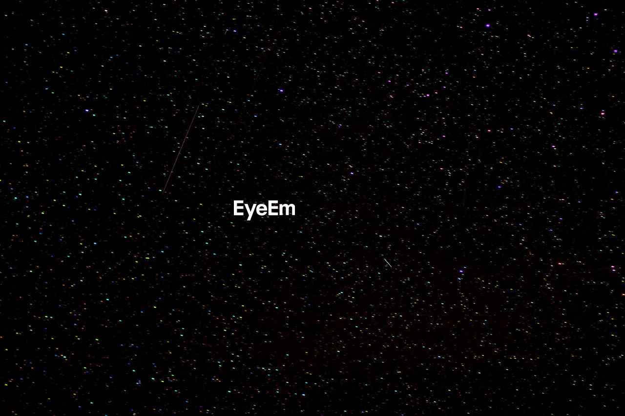 LOW ANGLE VIEW OF STAR FIELD AGAINST SKY AT NIGHT