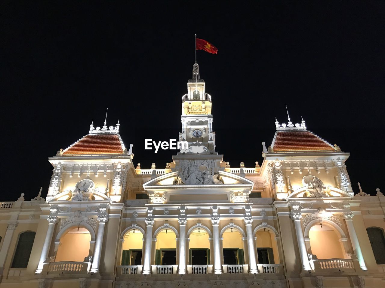 VIEW OF ILLUMINATED BUILDING AGAINST SKY