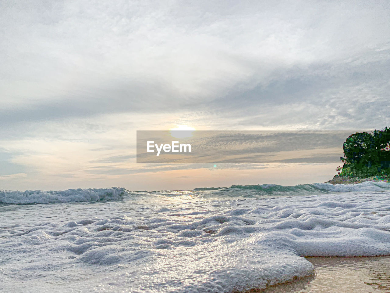 SCENIC VIEW OF BEACH DURING SUNSET