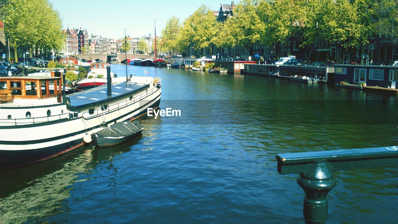 BOATS MOORED IN HARBOR