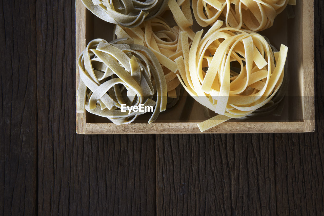 Tagliatelle in box on table