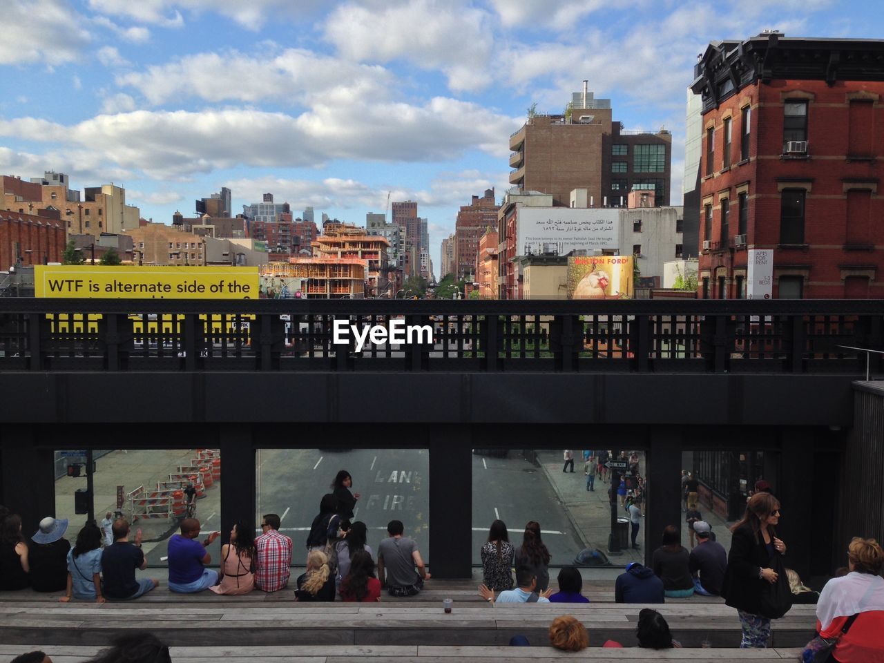 People gathering in city scenery with urban constructions