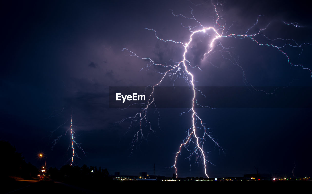 Scenic view of lightning fork in dramatic sky at night