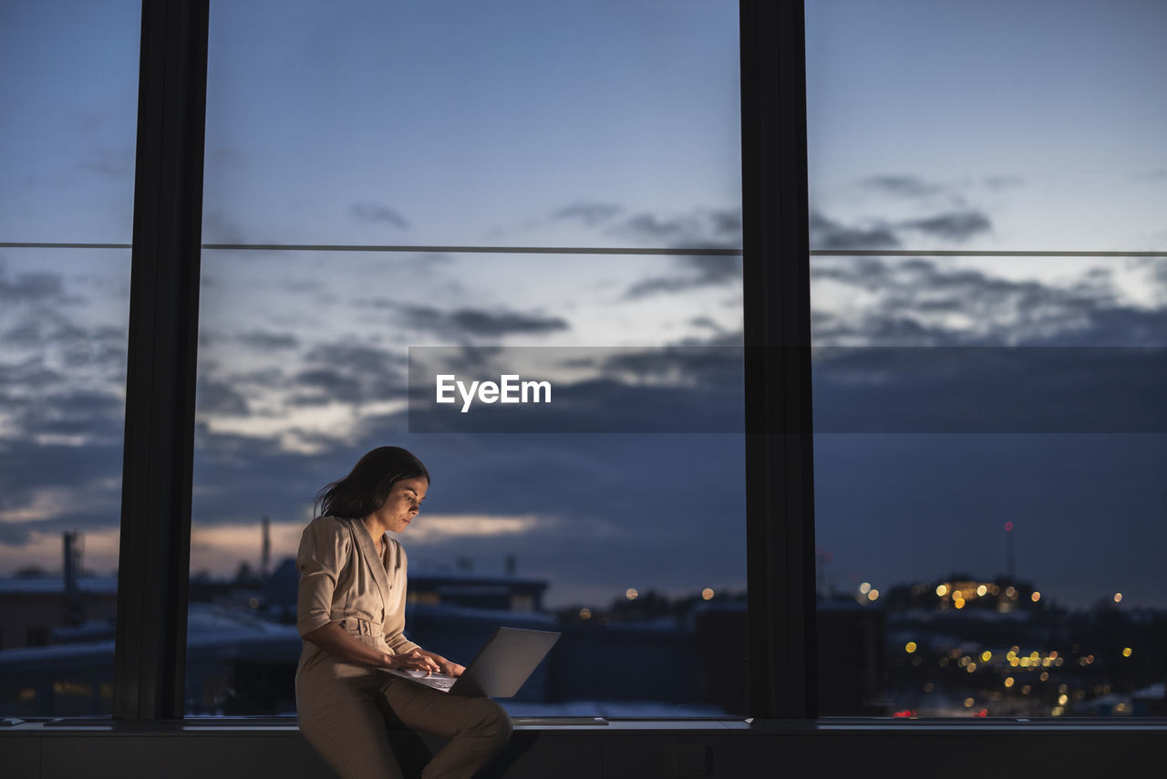 Businesswoman working late in office