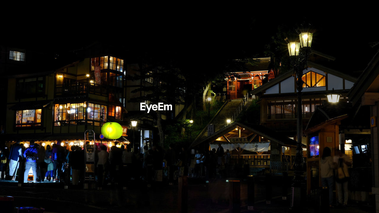 Illuminated buildings in city at night