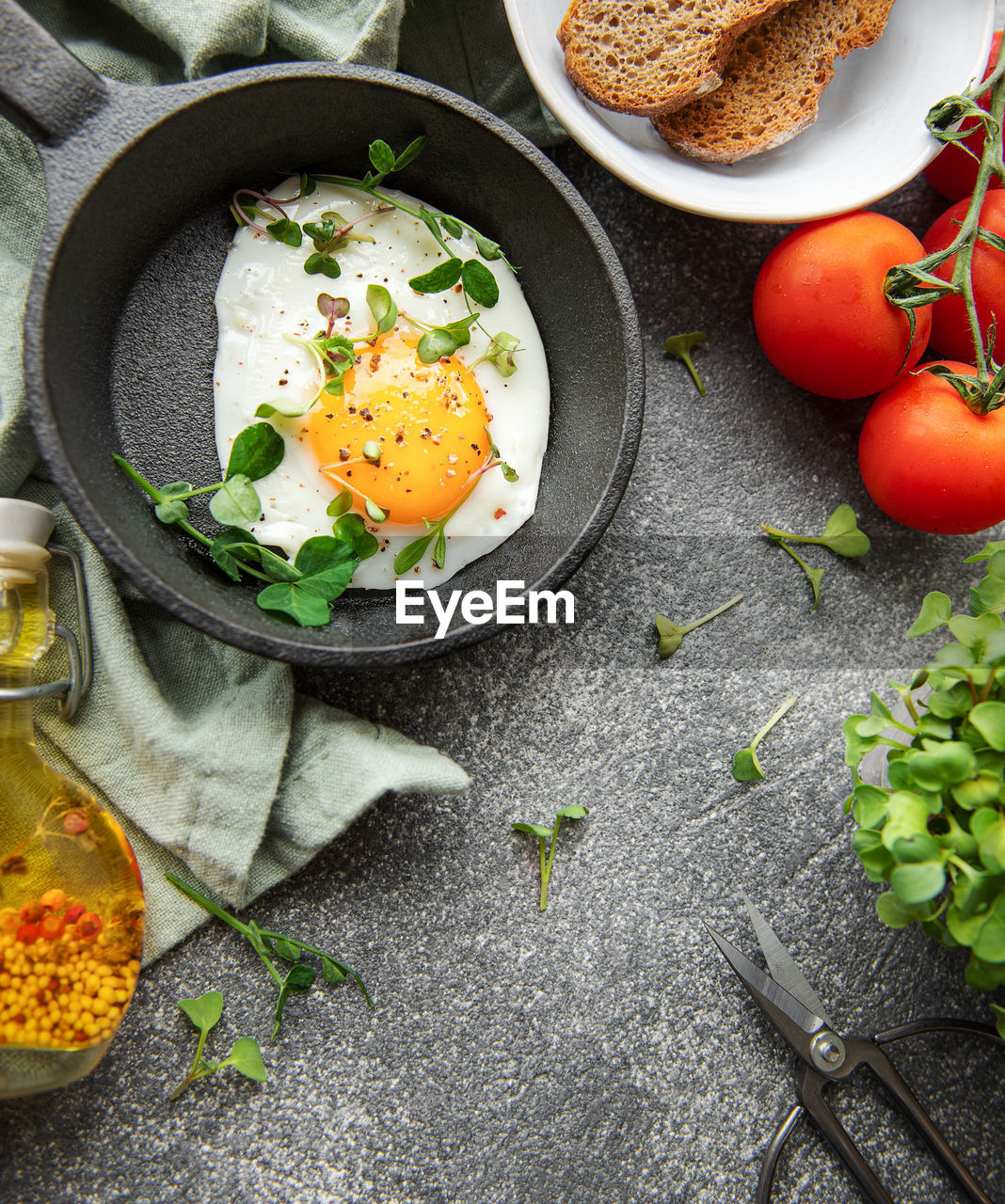 Delicious gourmet breakfast. rye bread with fried egg, freshly ground pepper and salad 