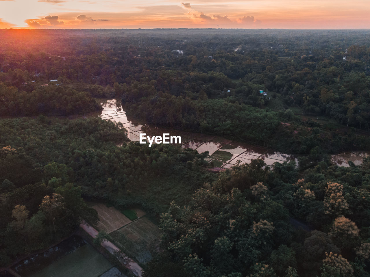 High angle view of rural landscape during sunset