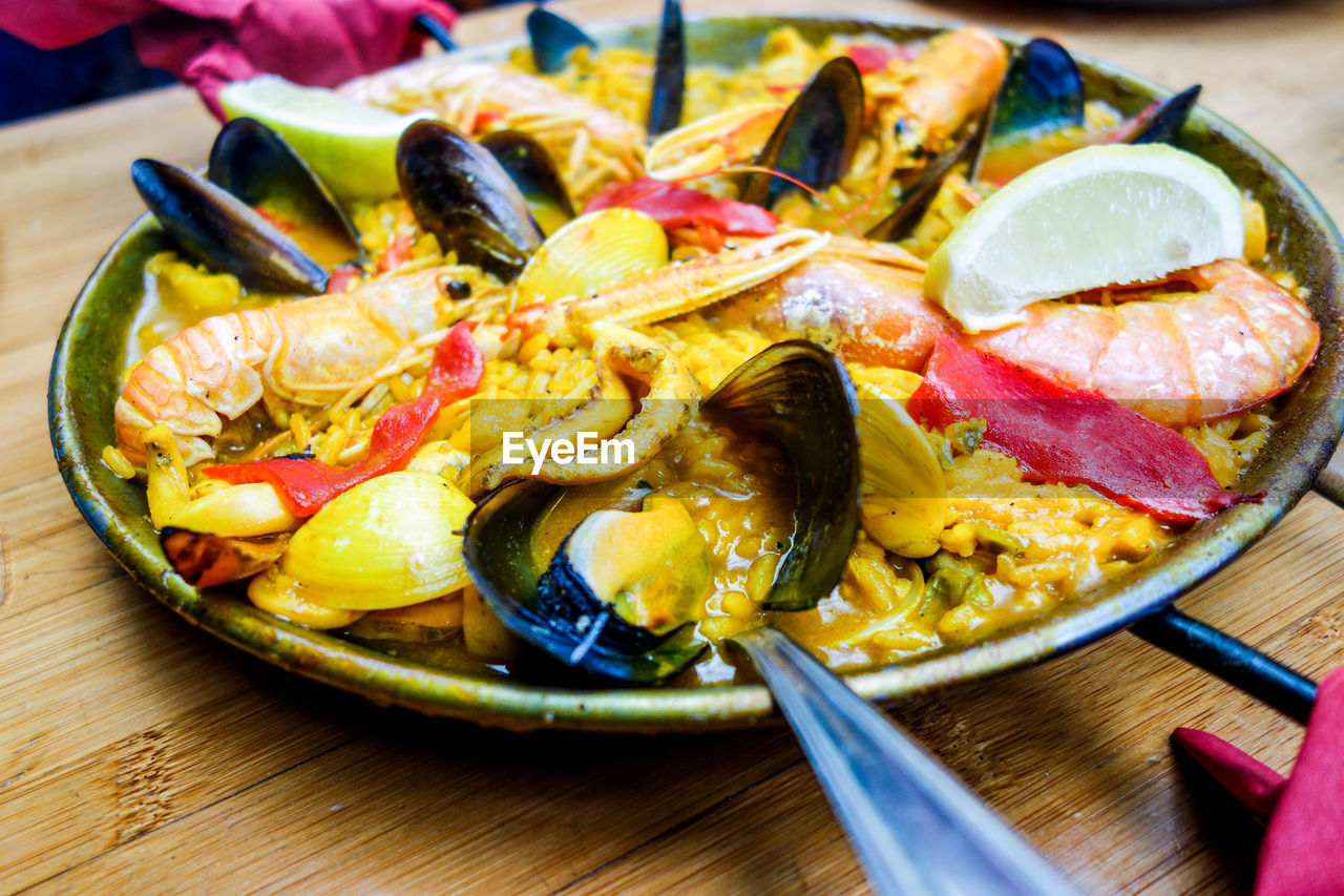 Close-up of paella served on table