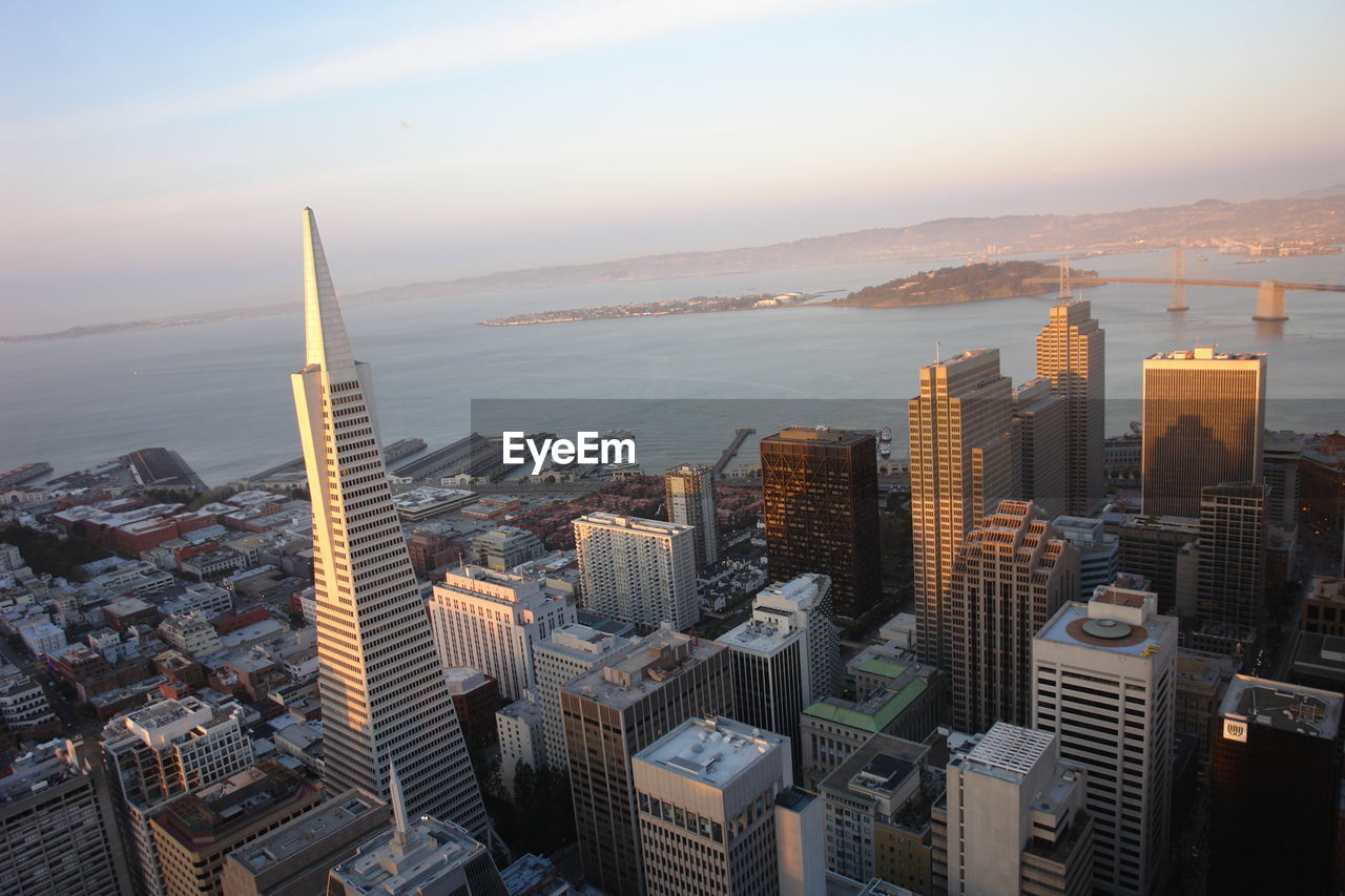 High angle view of city buildings during sunset