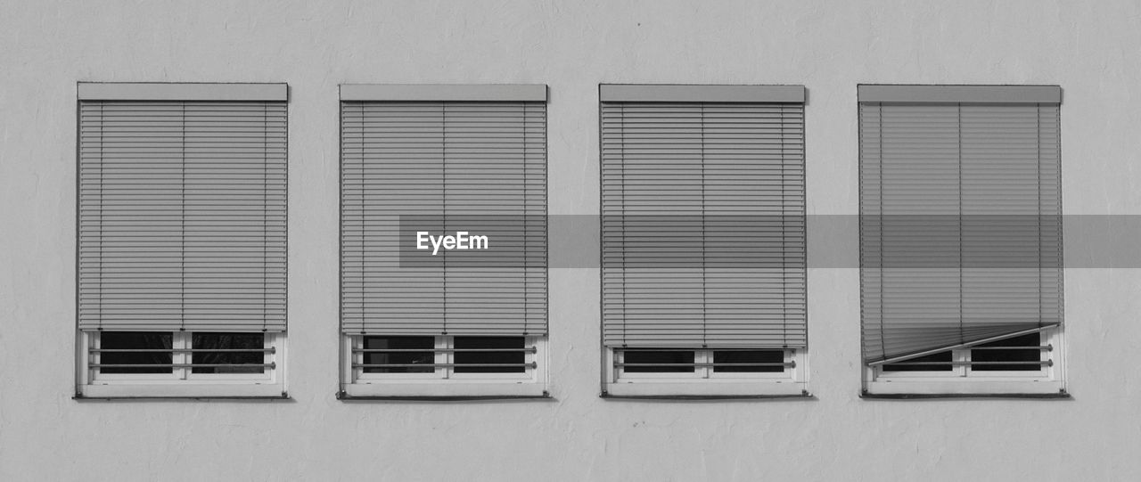 Four similar windows with blinds