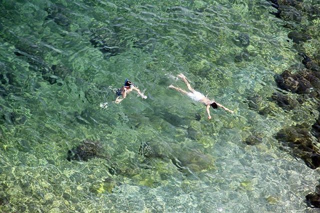 TOURISTS IN WATER