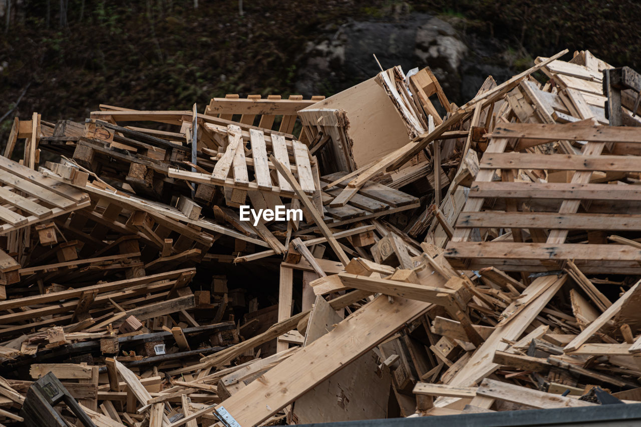 Pile of old and broken wooden pallets