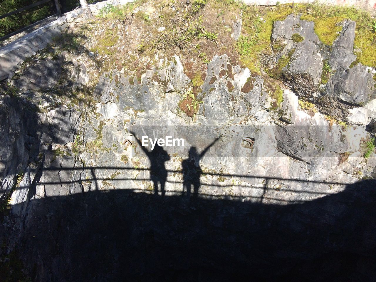 Shadow of people on rock formation
