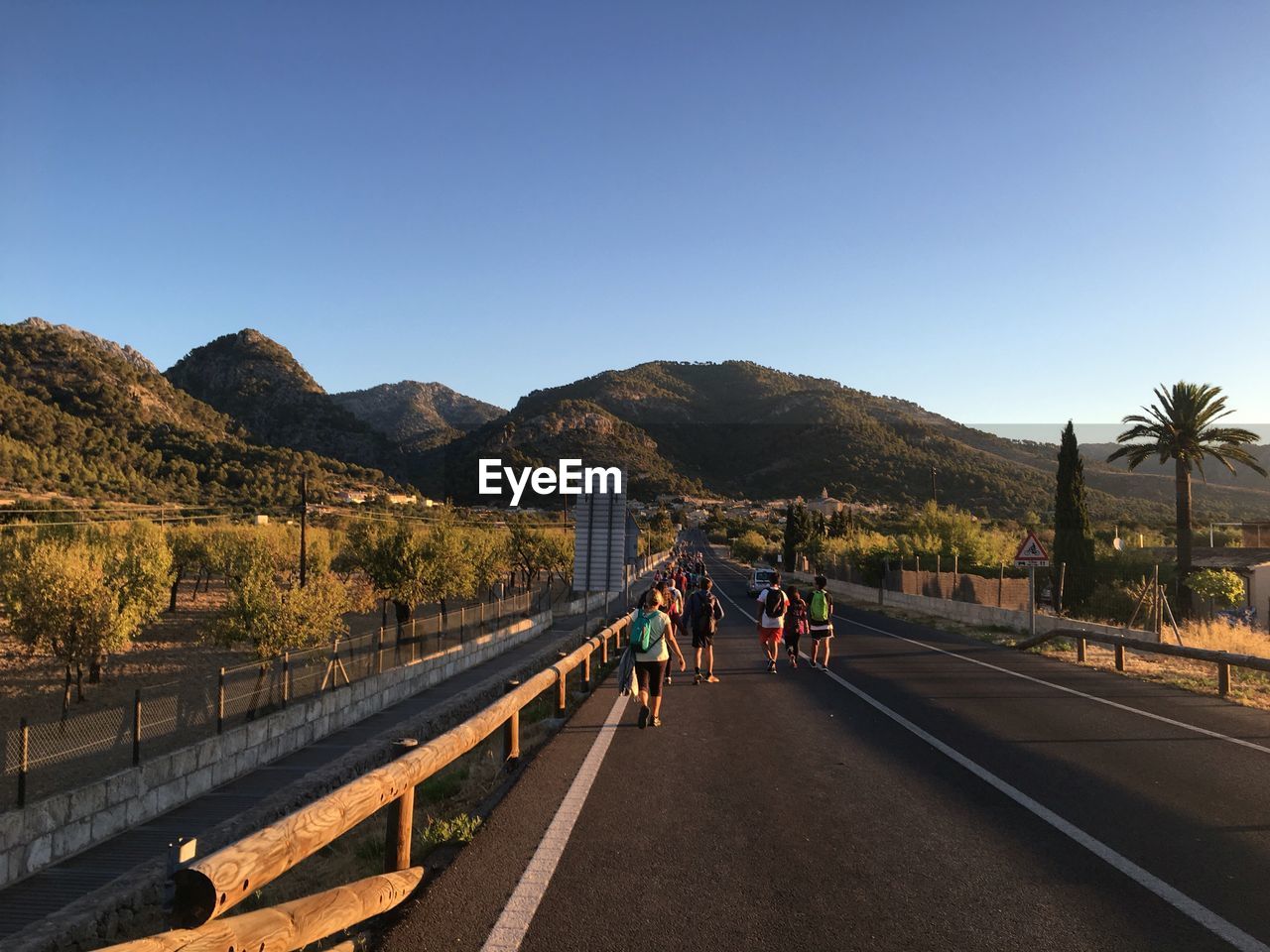 Empty road with mountains in background