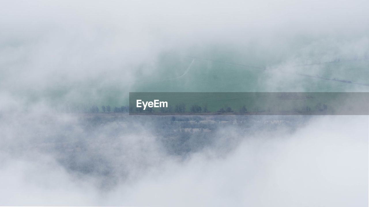 VIEW OF FOGGY WEATHER AGAINST SKY