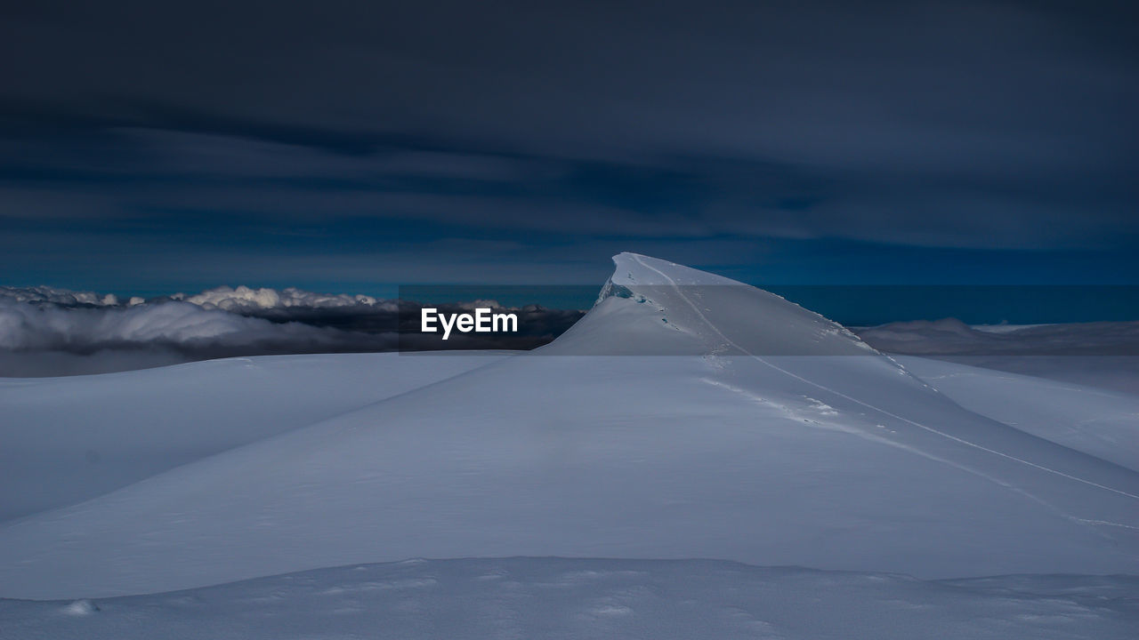 Snow covered mountain against sky