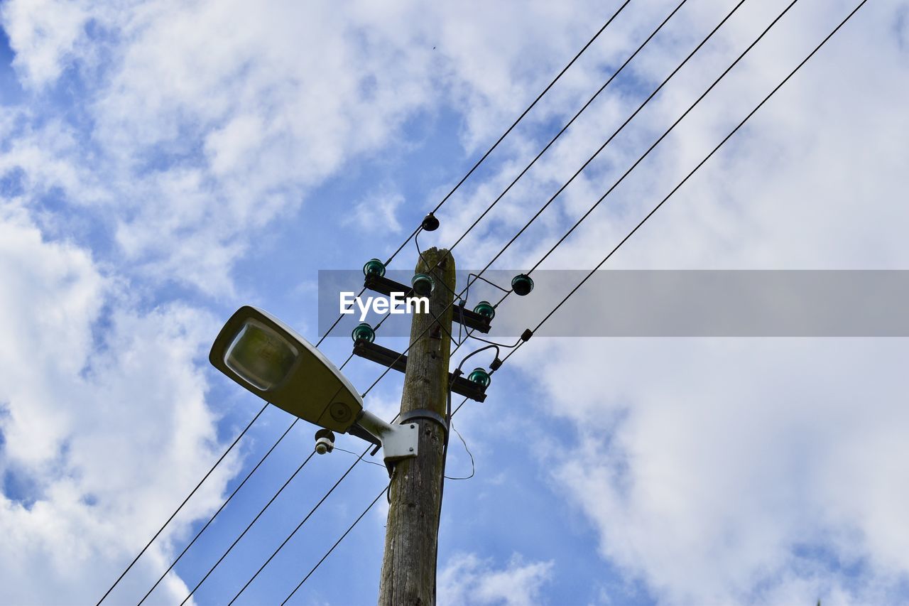 LOW ANGLE VIEW OF POWER LINES AGAINST SKY