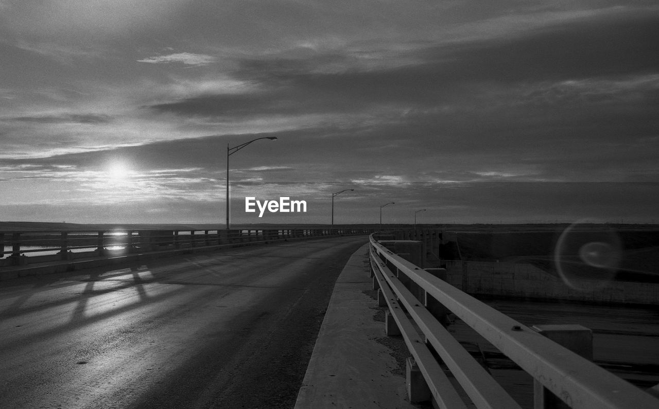 Cars on road against sky at night